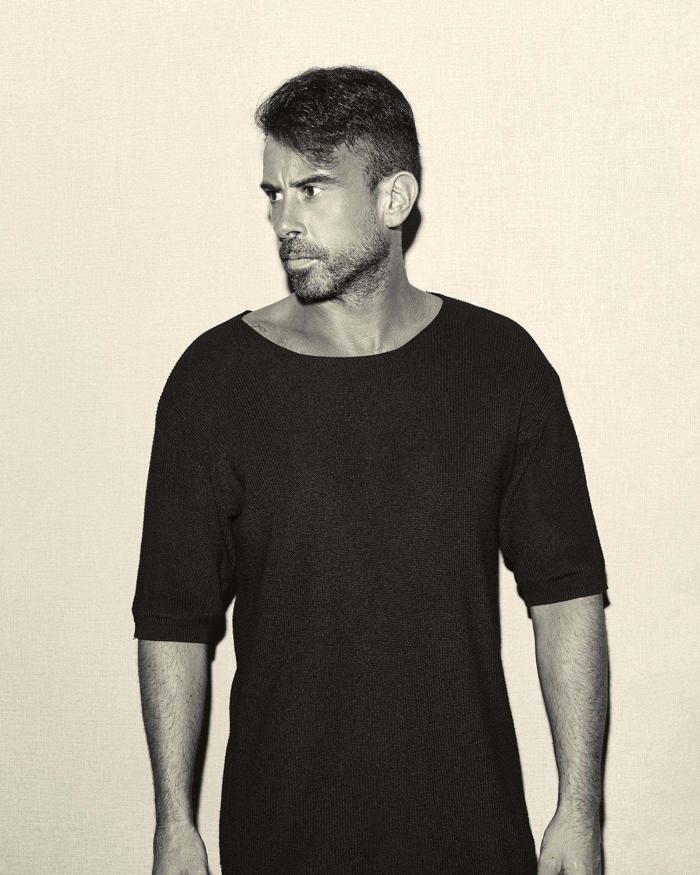 ARACIL, melodic techno and deep house producer, studio portrait against a plain backdrop